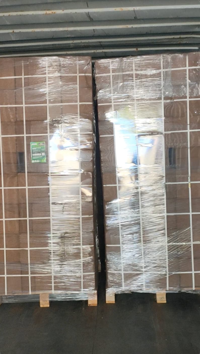 Wrapped pallet of cocopeat blocks staged and ready to be lifted into the container.